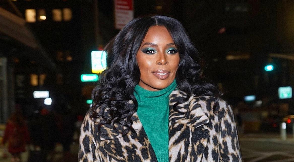 Tasha Smith in a leopard print jacket