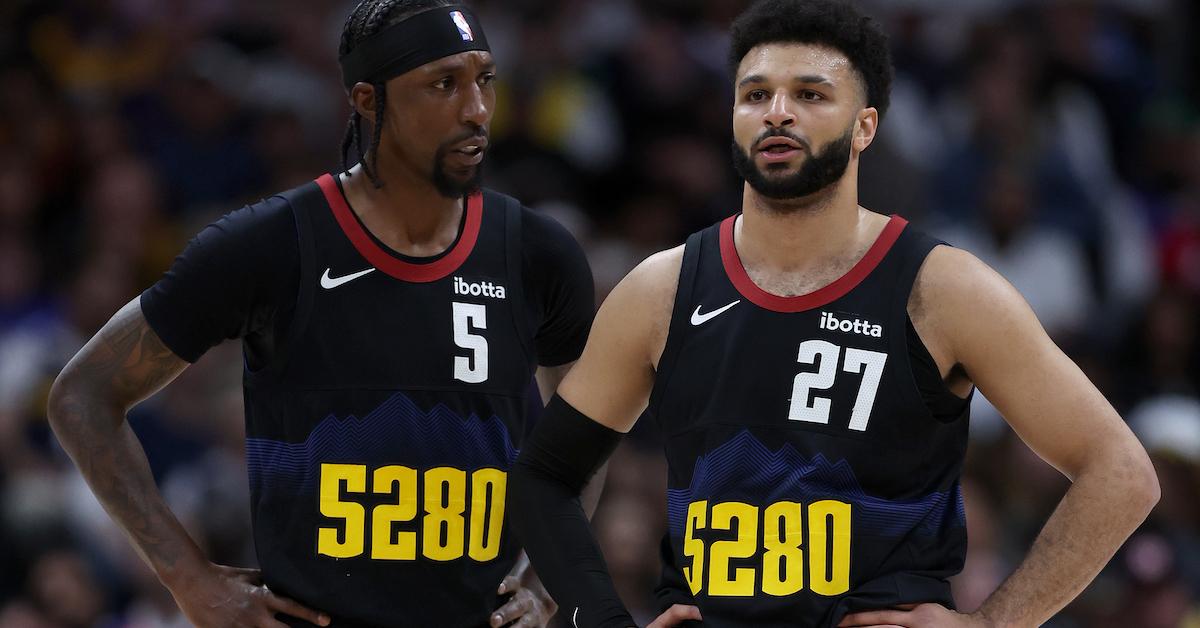 Kentavious Caldwell-Pope #5 and Jamal Murray #27 of the Denver Nuggets confer while playing the Los Angeles Lakers in the second quarter during game two of the Western Conference First Round Playoffs at Ball Arena on April 22, 2024 in Denver,
