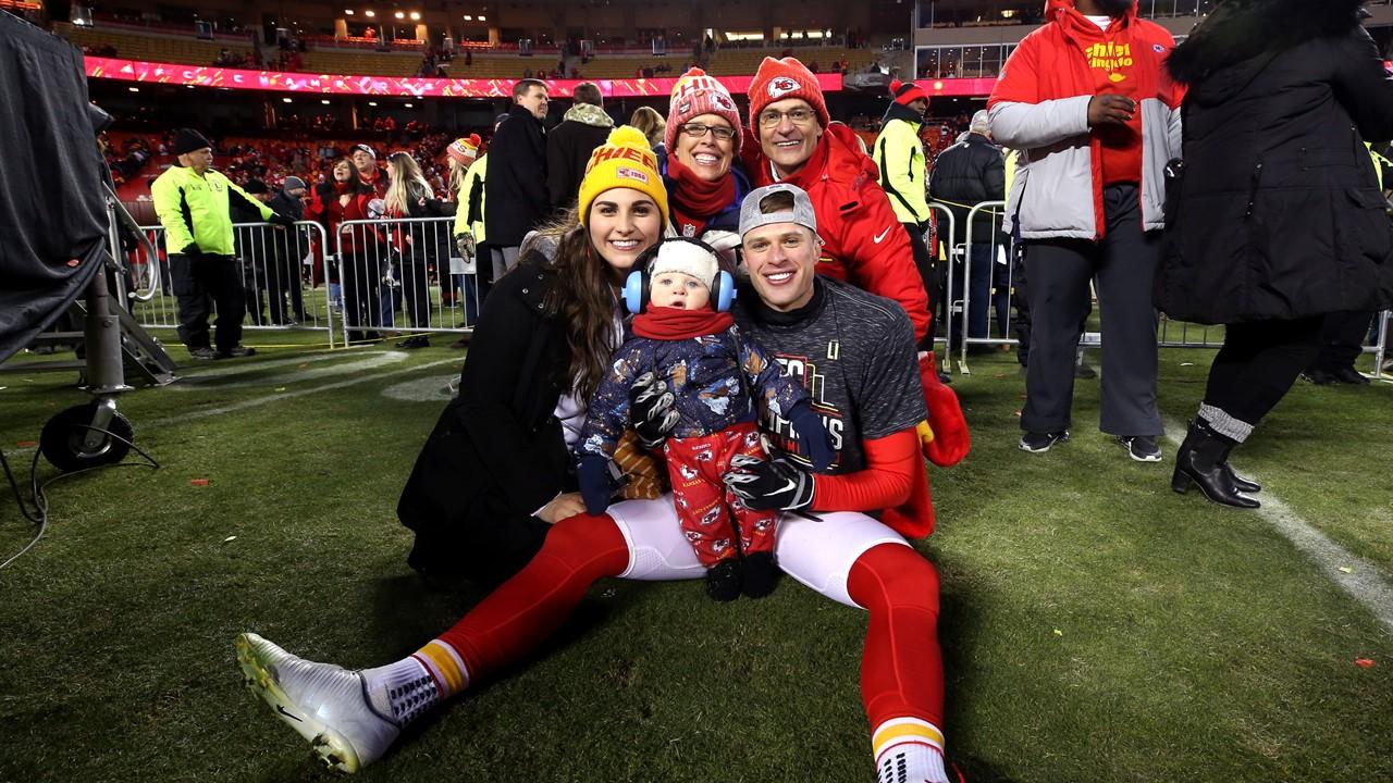 Harrison Butker on the field with his wife, son, and parents after AFC Championship Game at Arrowhead Stadium on Jan. 19, 2020