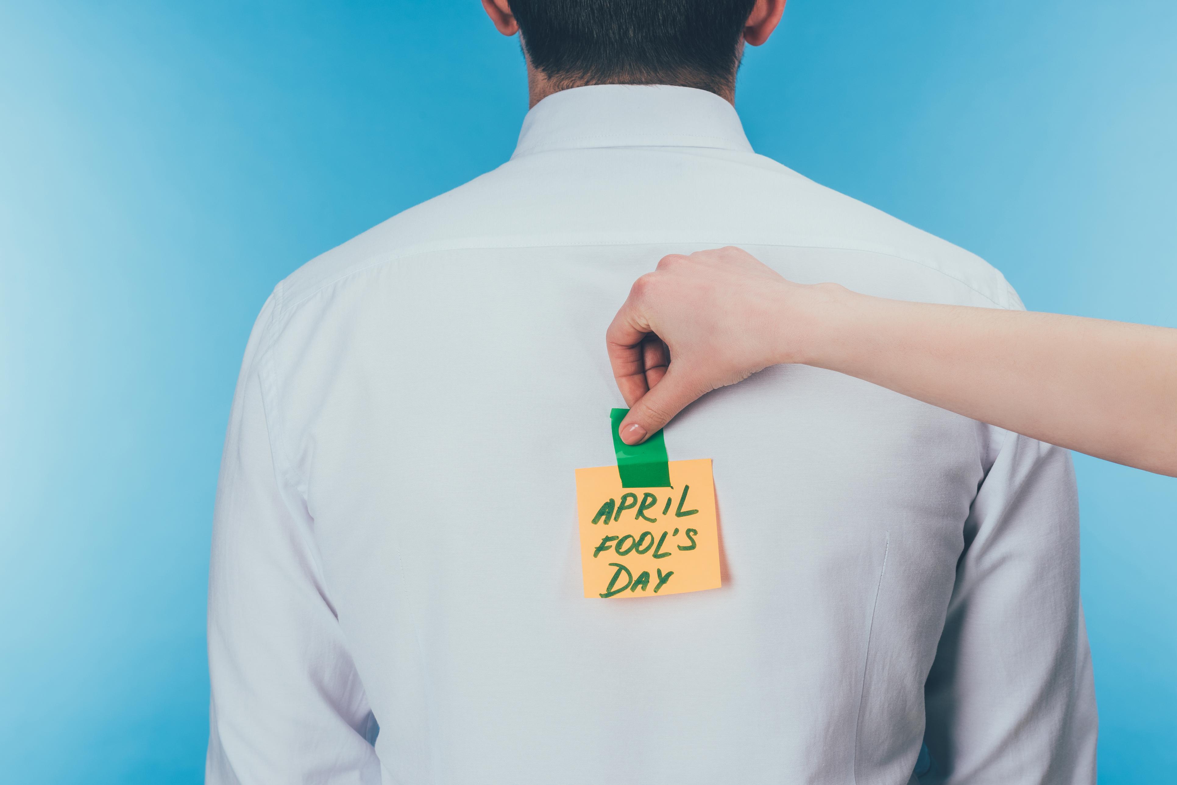 post it note on man's back